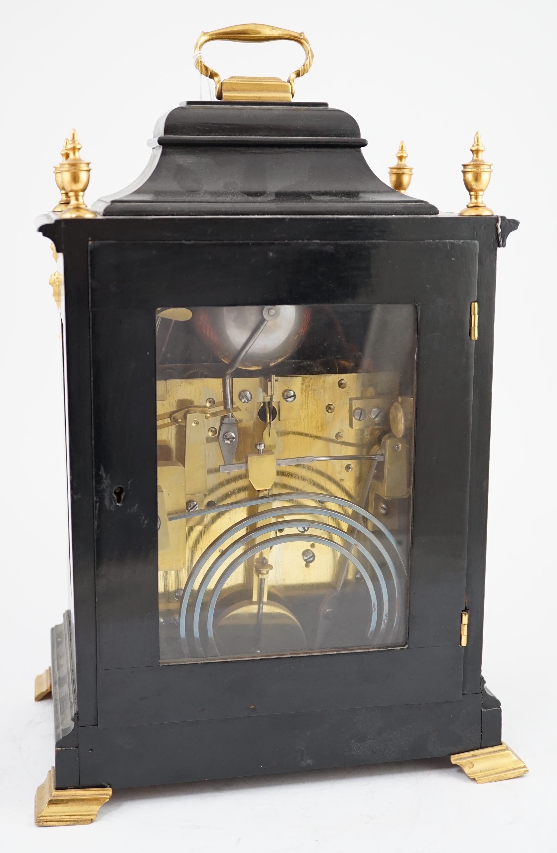 A Victorian ormolu mounted ebonised chiming bracket clock